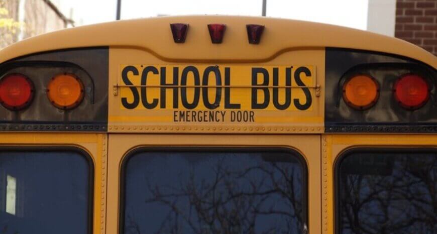 The back of a yellow school bus
